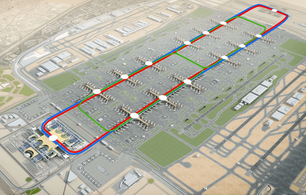 Aerial visualisation of the DWC concourses and terminal, with the tracks for the Automated People Mover highlighted Aerial visualisation of the DWC concourses and terminal, with the tracks for the Automated People Mover highlighted